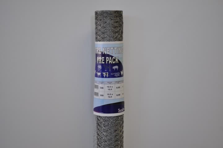 A close-up image of a roll of bird wire and chicken wire from Parklea Sand & Soil's portfolio. The wire mesh is neatly wound on the roll, showcasing its durability and flexibility. The galvanized metal wires provide a sturdy barrier to prevent birds and small animals from accessing or damaging the surrounding area.