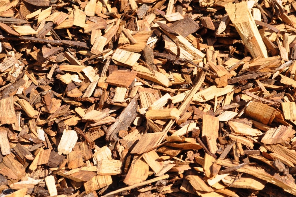 A close-up view of high-quality cypress pine wood chip from Parklea Sand and Soil, providing a natural and attractive ground covering solution.