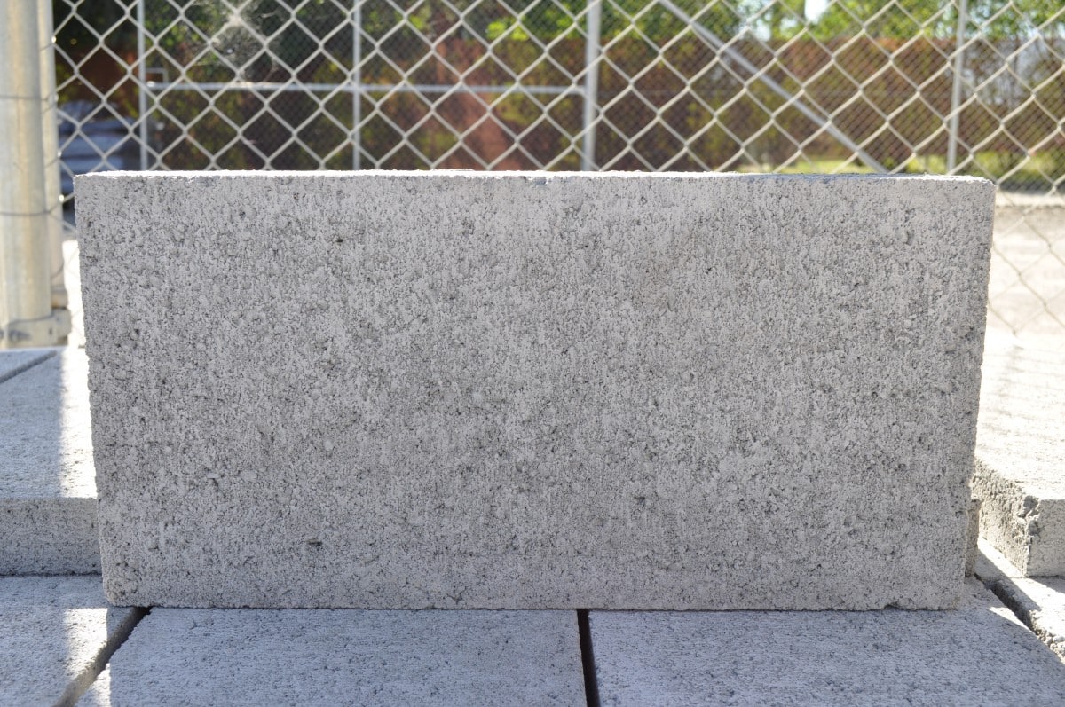 200mm Series Grey Block Caps are laid on top of a finished Besser Block wall using ‘brickies’ mortar. This provides a clean finish to the wall, hiding the internal core fill. Available at Parklea Sand & Soil Australia.