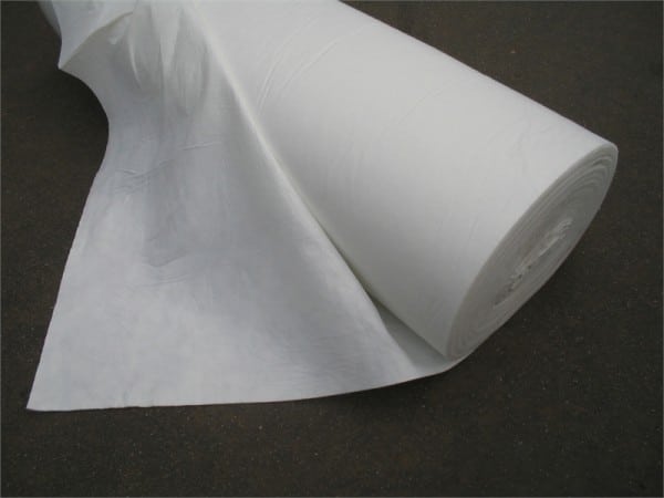 A roll of geotech fabric, a versatile and durable material used for erosion control, drainage, and soil stabilization. The fabric is made of high-quality synthetic fibers, designed to resist UV degradation and withstand environmental conditions. Its permeable nature allows water to pass through while retaining soil particles, preventing erosion and promoting healthy plant growth. Geotech fabric is commonly used in landscaping, construction, and agricultural projects.