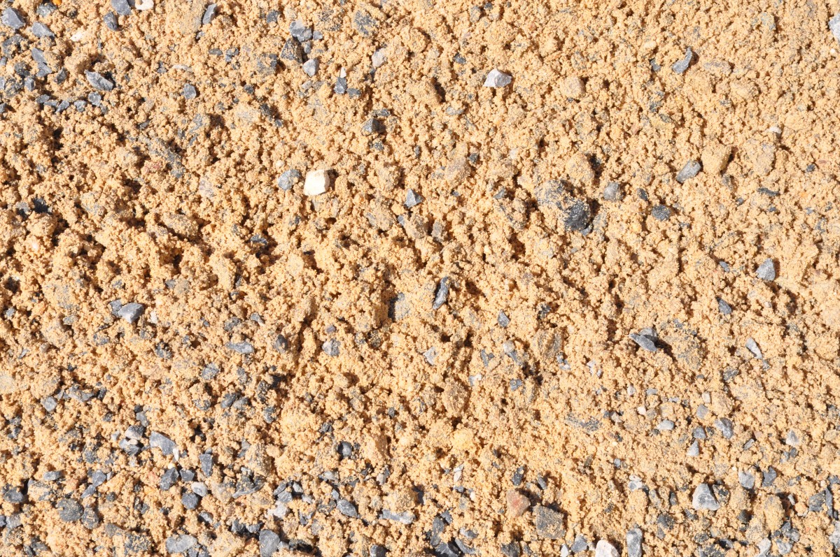 A webpage showcasing an assortment of sand, gravel mix, and concrete mix products from Parklea Sand & Soil. The image displays neatly stacked bags and piles of different aggregates, ranging in size, color, and texture. The products are vital for construction and landscaping projects, providing the foundation for solid structures and decorative elements.