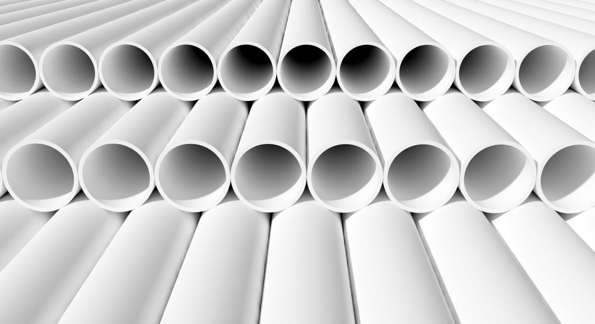 A collection of stormwater pipes neatly stacked in a warehouse. The pipes are made of durable materials and come in various sizes and shapes. They are designed to efficiently manage and redirect rainwater and storm runoff, ensuring proper drainage and preventing flooding. These pipes are essential for effective stormwater management systems in residential, commercial, and industrial settings.