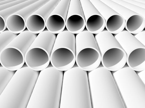 A collection of stormwater pipes neatly stacked in a warehouse. The pipes are made of durable materials and come in various sizes and shapes. They are designed to efficiently manage and redirect rainwater and storm runoff, ensuring proper drainage and preventing flooding. These pipes are essential for effective stormwater management systems in residential, commercial, and industrial settings.