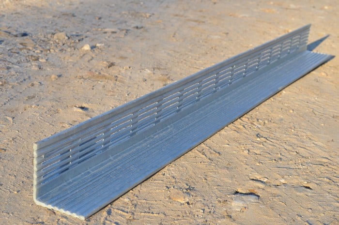 Image showcasing Parklea Sand & Soil's Galvanised Rendabar product - a sturdy and versatile metal mesh used for rendering and plastering applications. The Galvanised Rendabar features a strong galvanized coating for enhanced durability and resistance to corrosion. Its rigid structure ensures excellent adhesion for render and plaster materials, making it an ideal choice for construction projects. The product is showcased in a neatly organized display, with rolls of Galvanised Rendabar stacked in the foreground, ready for use.