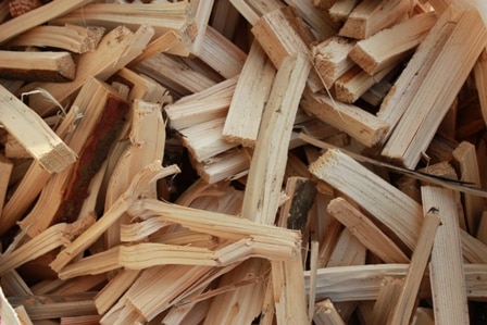 Alt-text: "A stack of neatly arranged kindling wood, ready to be used for starting fires. The kindling consists of small, dry pieces of wood that are perfect for igniting larger logs. The natural colors and textures of the kindling create a rustic and cozy atmosphere. This high-quality kindling is available for purchase at Parklea Sand and Soil, your reliable source for all your firewood needs.