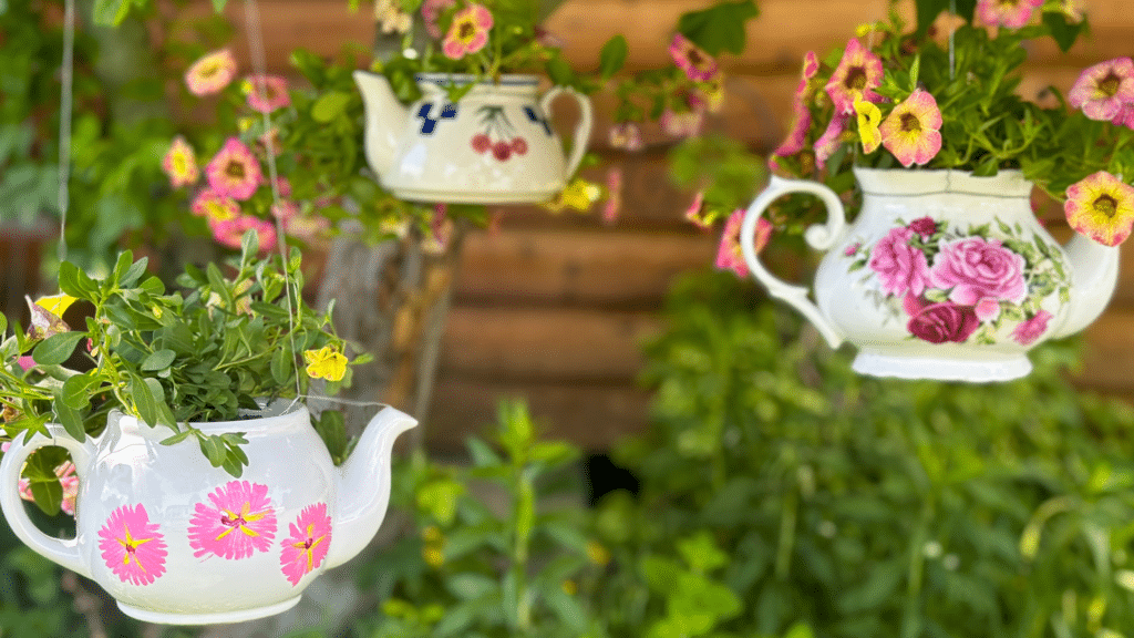 Teacups/teapots repurposed as a hanging pots for plants and flowers. DIY sustainable landscape designs by Parklea Sand & Soil Australia. 