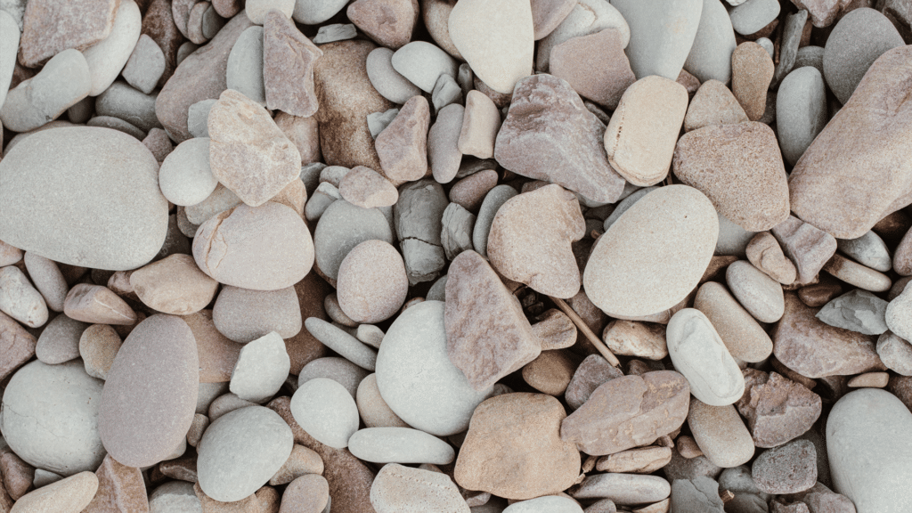 Pebbles in rock garden for draught-resistant garden landscape. Supplies by Parklea Sand & Soil Australia.