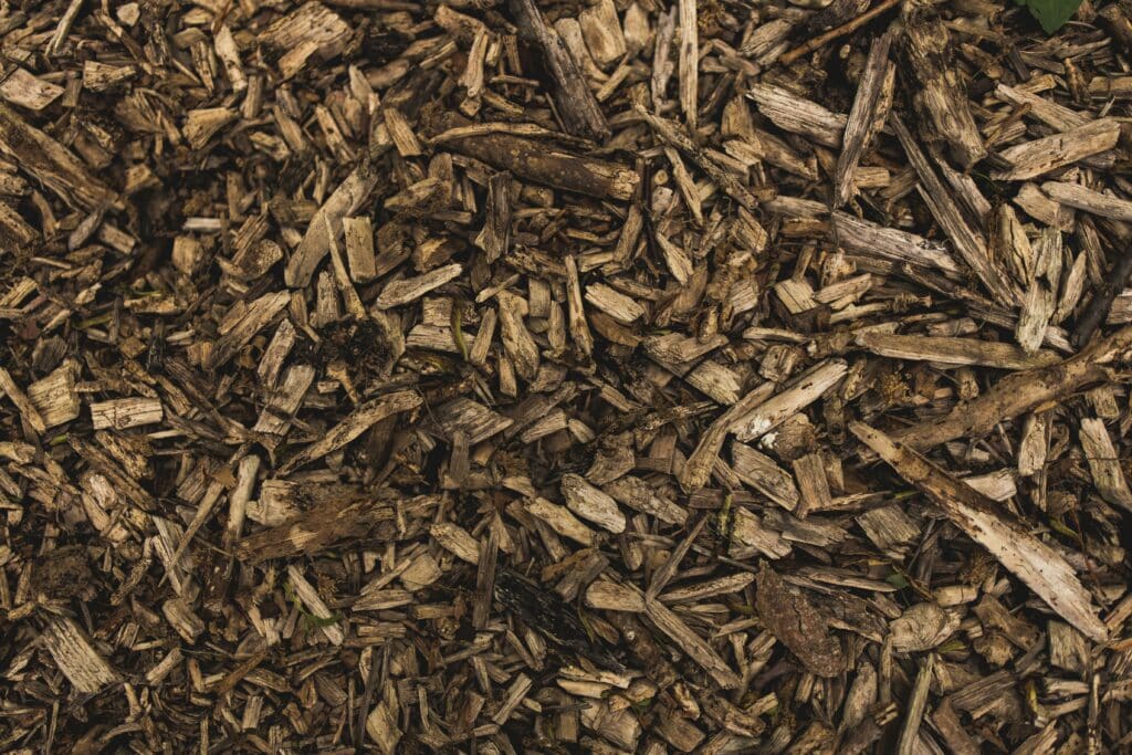 Mulching- applying a layer of organic mulch, such as wood chips or straw, to the soil surface. Improves soil insulation and water retention. Supplies by Parklea Sand & Soil. Maximising Water Conservation.