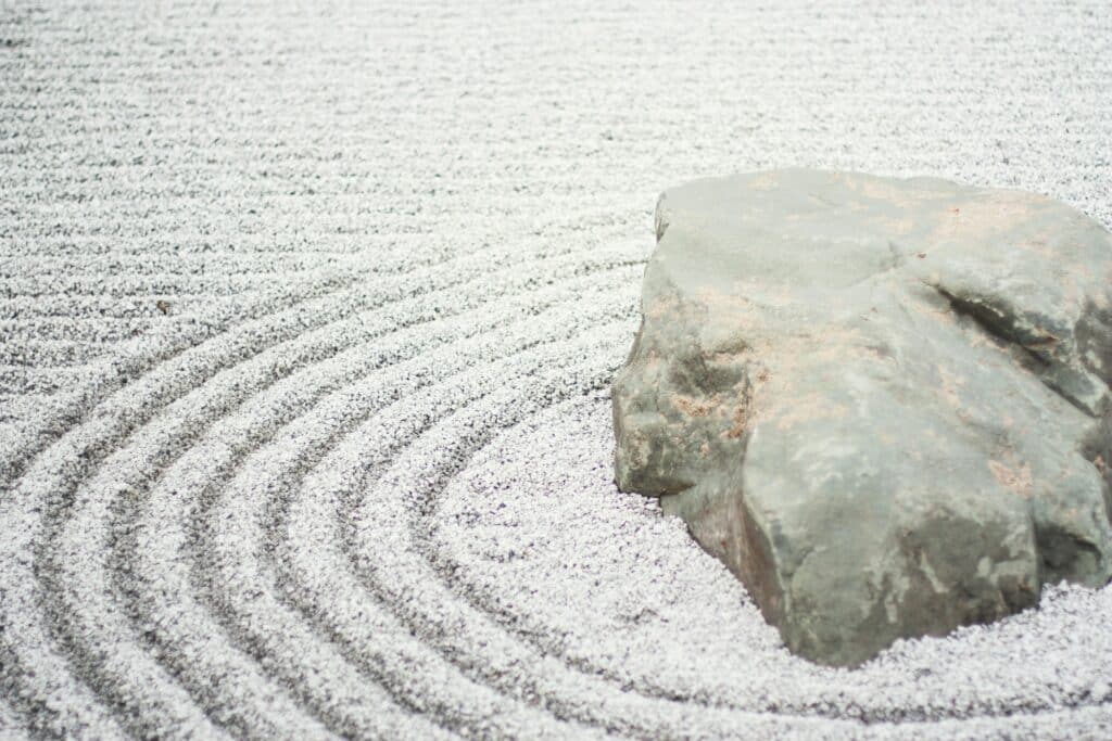 Rock in the middle of raked pebbles, zen garden. Creating Zen Gardens in Sydney.
